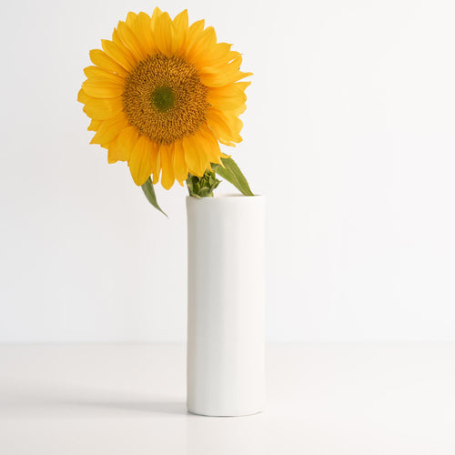 Display your flowers in something as beautiful as they are — handcrafted porcelain that elevates any surface